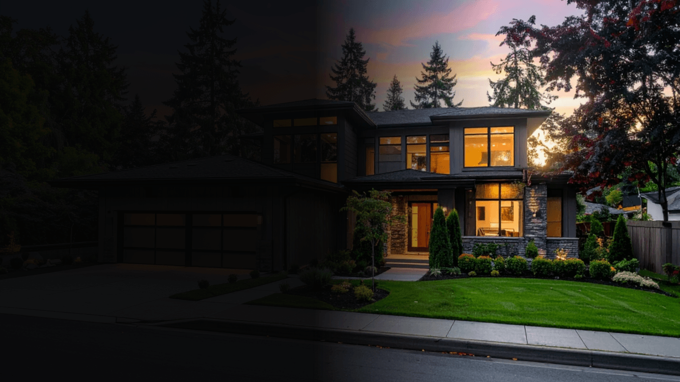 Modern custom home exterior with warm interior lighting
