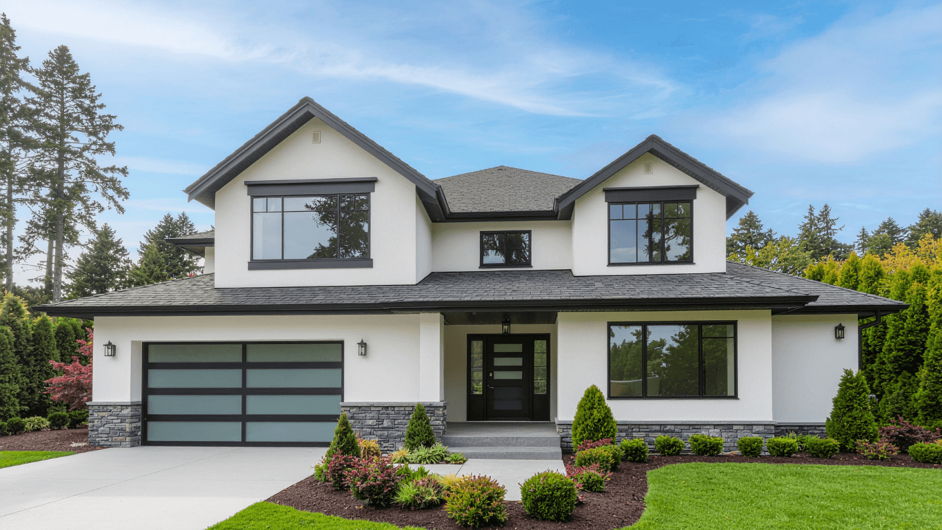 Modern custom home exterior with warm lighting